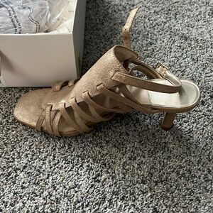 Never worn heels. Gold shimmer color. Small heel